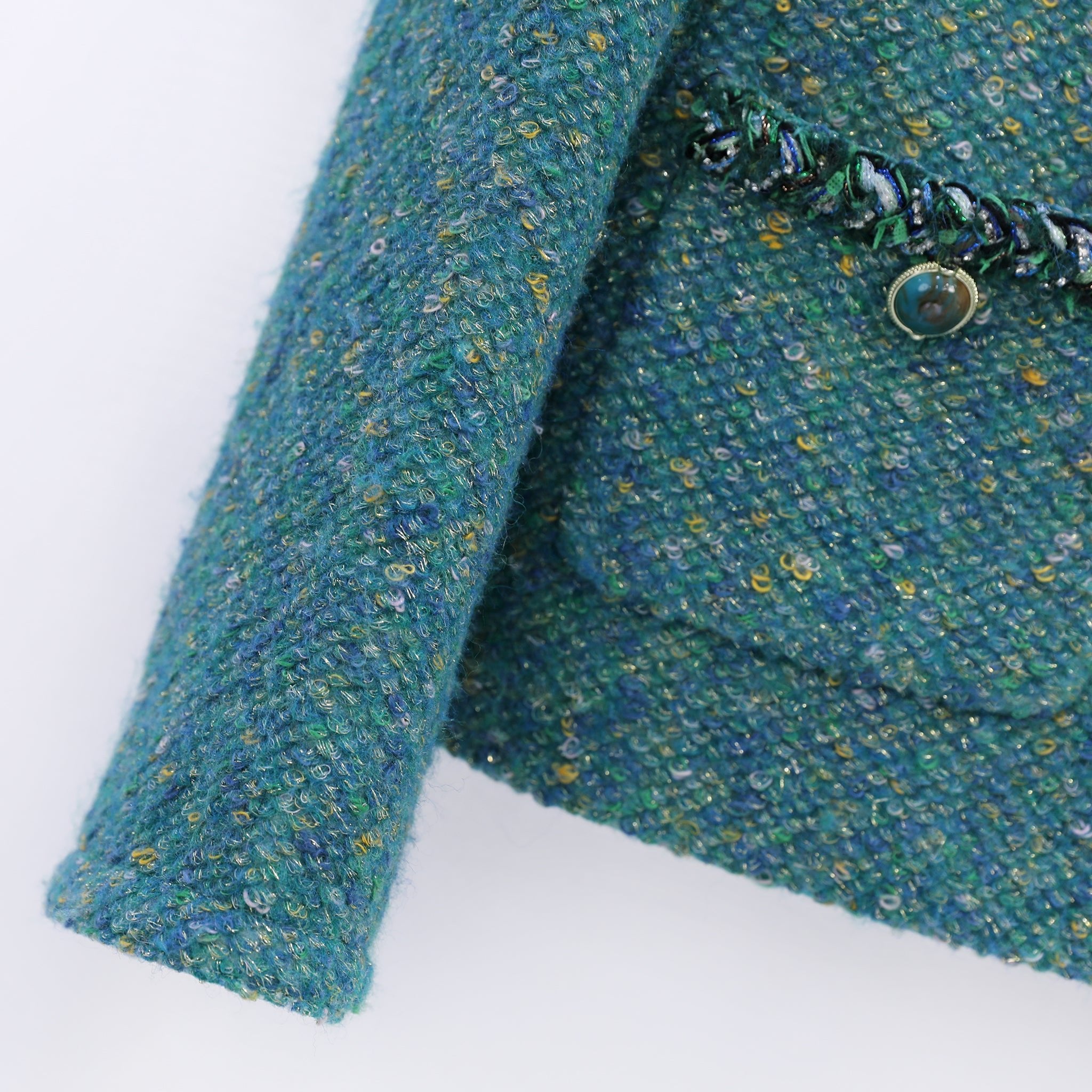 Sleeve detials of green tweed jacket